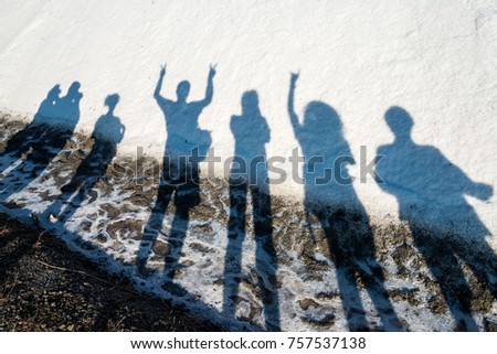 Abstract composition of human shadows on a pile of salt
