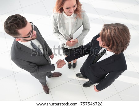 Business men shaking hands making an agreement