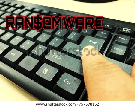 ransomware virus hand push the enter keyboard to start the virus.