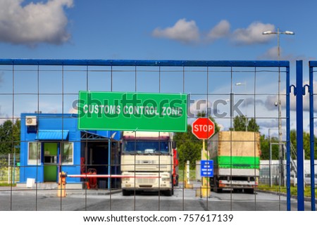 


Lorries pass through the security checkpoint of the logistics complex with customs services. Royalty-Free Stock Photo #757617139