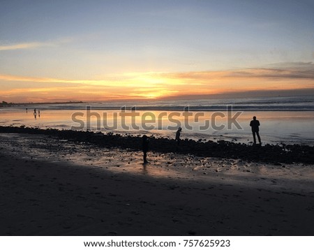 Sunset on a beach Royalty-Free Stock Photo #757625923
