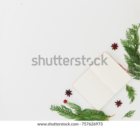 Creative composition of notebook with fir tree on white table top view. Planning concept. Christmas background. Flat lay. Copy space 