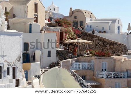 Cubiform traditional houses clinging to the cliffs of Fira on Santorini Island, Greece. Royalty-Free Stock Photo #757646251