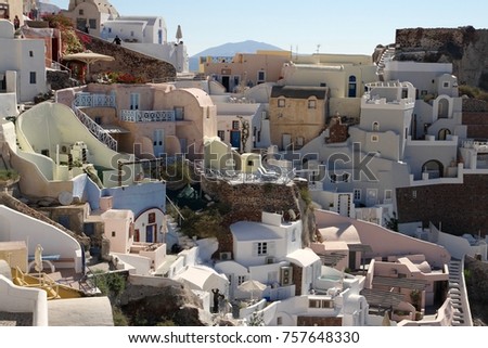 Cubiform traditional houses clinging to the cliffs of Fira on Santorini Island, Greece. Royalty-Free Stock Photo #757648330