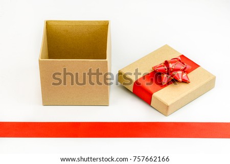 Gift box with red bow ribbon for Christmas isolated on white background