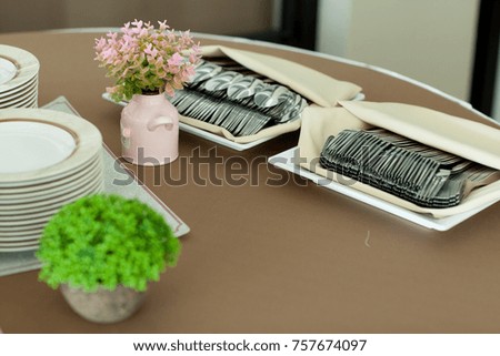 Catering Equipment Serving tray, spoon, dish, food tray, glass, water arranged beautifully.