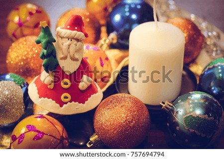 Santa Claus doll.  The Accessories for Christmas tree and a candle