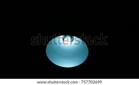 The abstract art light lamp on black background