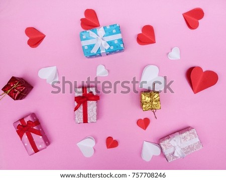 Red paper heart and Gift Box isolated on pink background with copy space