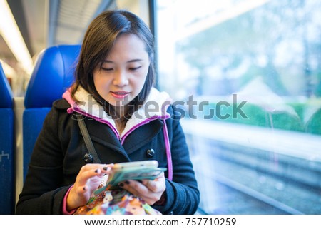 Woman using smartphone for search and check information.