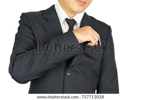 Businessman in suits takes out credit cards from the pocket of his suit on isolated white background.