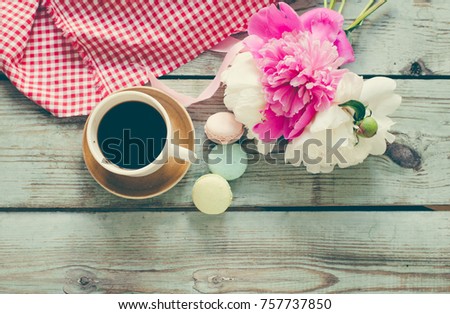Cup coffee and flowers/toned photo