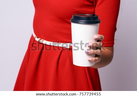 White glass. Fragrant hot coffee. Red background.