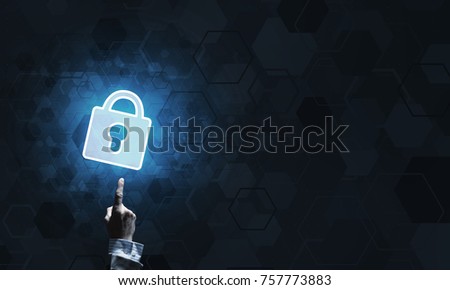 Lock glowing icon pressed with finger on dark background