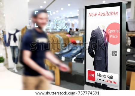 Intelligent Digital Signage , Augmented reality marketing and face recognition concept. Interactive artificial intelligence digital advertisement in fashion retail shopping Mall.