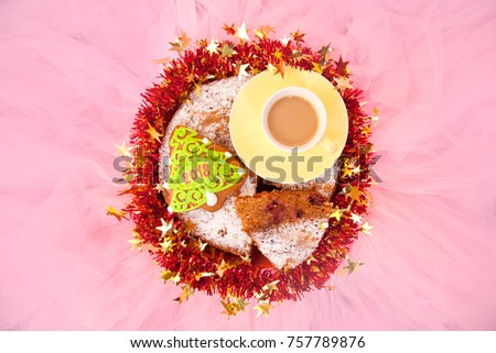 Small Cup Of Morning Coffee and a Bakery Tasty Sweets: Christmas Tree Gingerbread and Homemade Cherry Cake on Pink Background