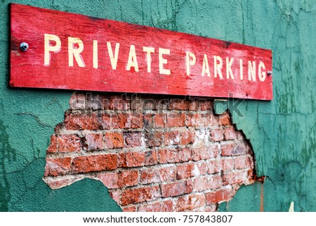 Private parking sign on flaking wall
