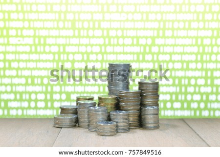 Digital economy. Coin stack increasing chart shape with green light and binary digital numbers background. Business, finance and saving concept.