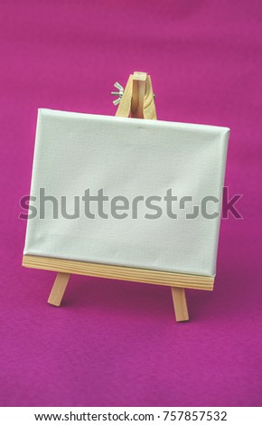 Empty canvas for painting on pink background