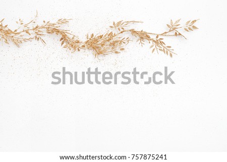 Gold colored christmas garland with copy space, flat lay