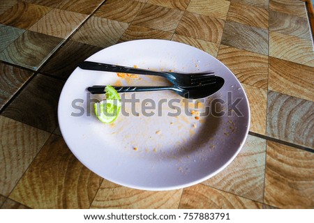 Lemon Fork and Empty Rice Plate