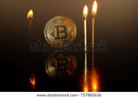 Golden bitcoin on black background with copy space cryptocurrency mining concept  burns; torch; fire