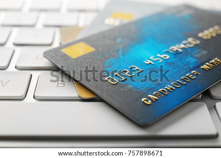 Credit cards on computer keyboard, closeup