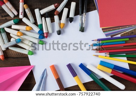 creativity concept - colour pencil, crayon, watercolour, paint brush, colourful paper and white paper for copy space