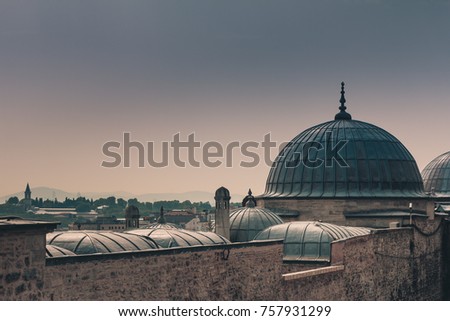 View of city Istanbul, Bosphorus bridge from Galata tower. Outer view of dome in Ottoman architecture. Suleymaniye Mosque. Turkey.