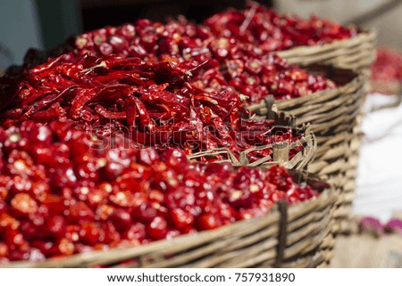 Dried red chills spices of Thailand. Blur picture. Red hot chili peppers in baskets at the local market