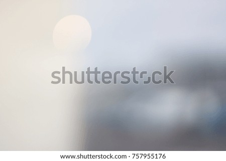 White, Light Background of Glass and Light Yellow Spots of Lights. Blurred Background. Urban Environment. Design Elements.