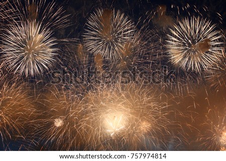 In the night sky fireworks explosions have created a fantastic picture of flying fires./Celebratory fireworks.