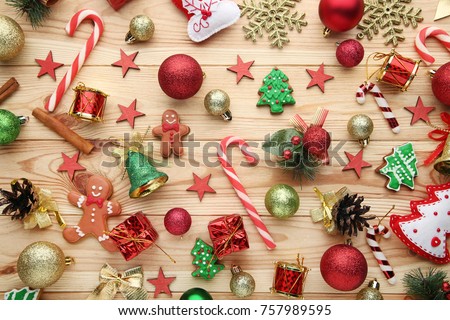 Christmas decorations with gingerbread cookies on brown wooden table