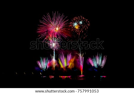 
Colorful fireworks on the beach, the shadow of the people waiting to see the beautiful fireworks. Can do this picture to celebrate New Year. 2018 or festivals And greetings cards
