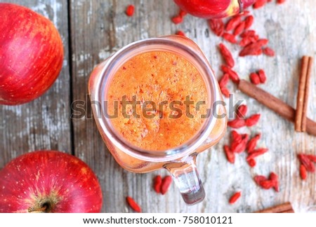 Healthy fresh smoothie drink from banan,kiwi,poppy seed and spirulin in glass on wooden background, up horizontal view