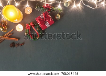 Table top view image of Christmas decoration & Ornament Happy new year background concept.Lighting & Candle withe essential items for season on modern grunge grey wooden at home office desk with space