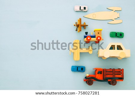Set of various cars and airplanes toys. Top view image