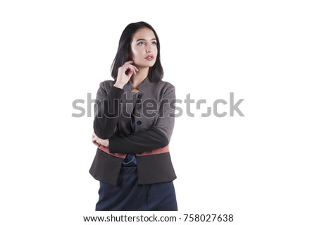 young serious businesswoman standing in a suit