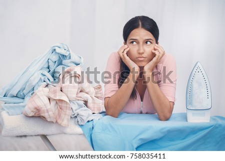 Young woman doing household duties housework concept