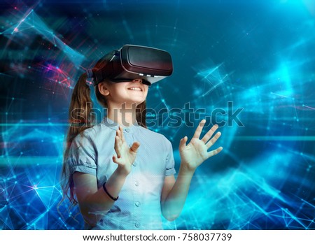 Young girl using virtual reality glasses. Future technology concept. Royalty-Free Stock Photo #758037739