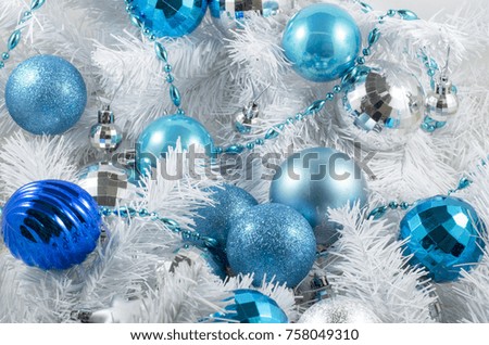 blue christmas decorations on a white background