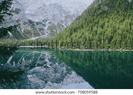 beautiful reflection of mountains and forests in the lake Braies. Italian Alps, European mountains