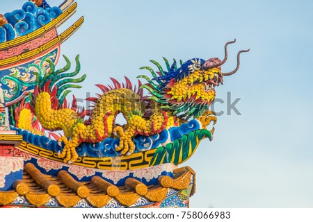 Yellow Dragon With a sky background.