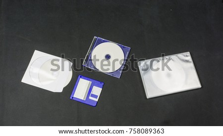 Floppy disk and CD in different packaging.
