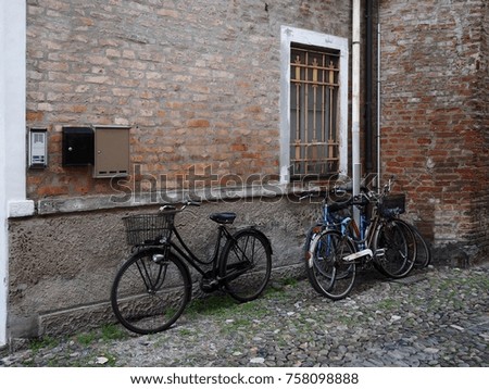 Ferrara, Italy. Medieval zone, old street with bikes.