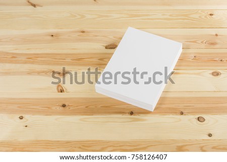 Mockup of magazine, poster, A4 brochure, catalog or flyer isolated on wooden background. Blank page top view for use in design, mockups and simulations.