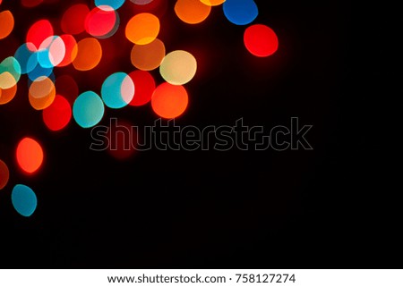 Colorful bokeh abstract background. Glittering stars on dark background. Lights. Garland. Background