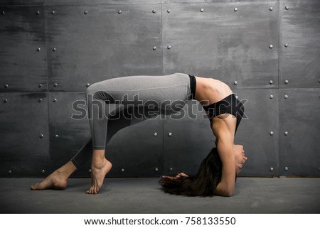 Girl in gym doing yoga