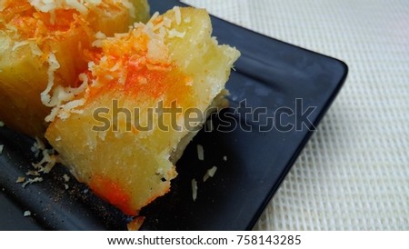 Singkong Keju, Indonesia Traditional Snack Food, made from Steamed Cassava and grated Cheese and Chili Powder for Topping
