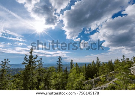 Beautiful landscape with forest, rock and sun in Koli National Park, Finland